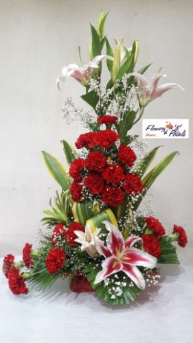 Lilies with carnations in flower arrangement